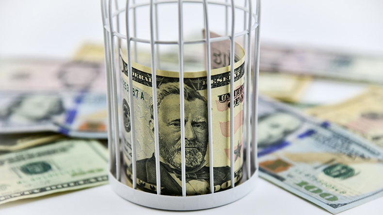 Trapped money (Robert Chlopas/Alamy Stock Photo)