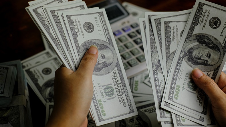 Dollars shared (chonticha stocker/Shutterstock.com)