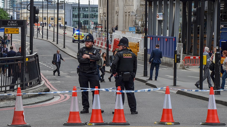 Police officers close off the approach to London Bridge following the June 3, 2017 terror attack (Adam Cowell/Shutterstock.com)