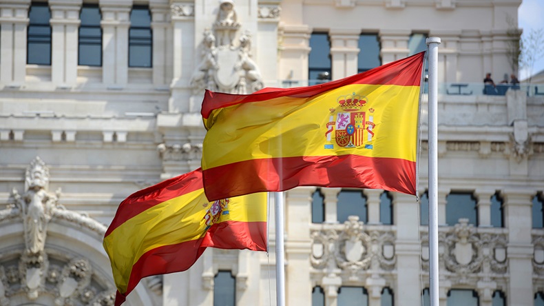 Spain flags (Wangkun Jia/Shutterstock.com)