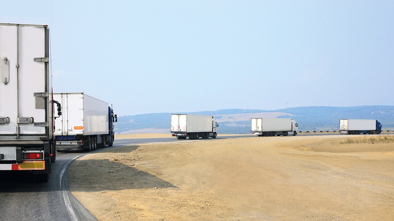 Truck convoy (Mikbiz/Shutterstock.com)